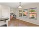 Breakfast nook with granite countertop, workstation, and bright windows with view of pool at 10133 Longoria St, Las Vegas, NV 89178
