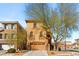 Charming two-story home with a two-car garage and a well-manicured front yard at 10133 Longoria St, Las Vegas, NV 89178