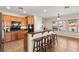 Open kitchen with granite countertops, breakfast bar, and stainless steel appliances at 10133 Longoria St, Las Vegas, NV 89178