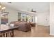 Bright, open-concept living and dining area with tiled floors and lots of natural light at 10133 Longoria St, Las Vegas, NV 89178