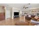 Spacious living room with tile flooring, ceiling fan, and comfortable seating area with natural lighting at 10133 Longoria St, Las Vegas, NV 89178
