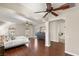Spacious main bedroom includes hardwood floors, ceiling fans, dresser, and bath at 10133 Longoria St, Las Vegas, NV 89178