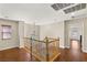 This is a staircase with wood railings, wood floors and a window with natural light at 10133 Longoria St, Las Vegas, NV 89178