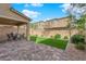 View of a backyard with a covered patio, barbecue and low-maintenance landscaping at 10792 Crestview Pointe Ave, Las Vegas, NV 89166