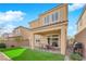 A well maintained backyard featuring a covered patio, grill area, and tidy landscaping at 10792 Crestview Pointe Ave, Las Vegas, NV 89166