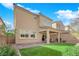 A well maintained backyard with a covered patio, grill area, and low-maintenance landscaping at 10792 Crestview Pointe Ave, Las Vegas, NV 89166