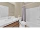 Bright bathroom featuring a shower and single vanity with wooden cabinet at 10792 Crestview Pointe Ave, Las Vegas, NV 89166