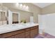 Bright bathroom with a double sink vanity, ample counter space, and a bathtub-shower combination at 10792 Crestview Pointe Ave, Las Vegas, NV 89166