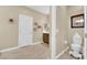 Cozy bathroom featuring a toilet and decorative wall art at 10792 Crestview Pointe Ave, Las Vegas, NV 89166
