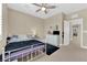 Inviting bedroom featuring a plush bed, ceiling fan, and neutral decor at 10792 Crestview Pointe Ave, Las Vegas, NV 89166