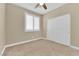 Comfortable bedroom with neutral carpet, ceiling fan, and plantation shutters for natural light at 10792 Crestview Pointe Ave, Las Vegas, NV 89166