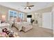 Bright bedroom with a vanity, shelving, television, and access to a shower room at 10792 Crestview Pointe Ave, Las Vegas, NV 89166