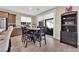 Dining area with sliding glass doors to the patio, offering a seamless indoor/outdoor flow at 10792 Crestview Pointe Ave, Las Vegas, NV 89166