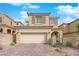 Charming two-story home featuring neutral colors, shuttered windows, tile roof and an attached two-car garage at 10792 Crestview Pointe Ave, Las Vegas, NV 89166