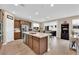 Open kitchen featuring a large island, stainless steel appliances, and sliding doors to the backyard at 10792 Crestview Pointe Ave, Las Vegas, NV 89166