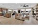 Open-concept living space featuring a kitchen, dining area, and comfortable living room at 10792 Crestview Pointe Ave, Las Vegas, NV 89166