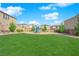 Community playground with a lush green lawn and benches, perfect for Gathering enjoyment at 10792 Crestview Pointe Ave, Las Vegas, NV 89166