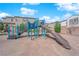 Community playground featuring a slide, climbing structures and comfortable shaded seating at 10792 Crestview Pointe Ave, Las Vegas, NV 89166