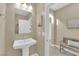Powder room with a pedestal sink, neutral colors, and tile floors at 10792 Crestview Pointe Ave, Las Vegas, NV 89166