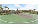 Community basketball court with palm trees, playground and nearby residential buildings at 12367 Indigo Montage Rd # 3, Las Vegas, NV 89183