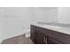 Bathroom features a granite countertop and dark wood vanity at 12367 Indigo Montage Rd # 3, Las Vegas, NV 89183
