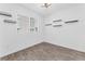 Minimalist bedroom with a window and sleek, wood-look vinyl flooring at 12367 Indigo Montage Rd # 3, Las Vegas, NV 89183