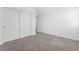 Bedroom featuring neutral carpet and a closet with sliding white doors at 12367 Indigo Montage Rd # 3, Las Vegas, NV 89183