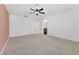 Spacious carpeted bedroom with ceiling fan and white walls at 12367 Indigo Montage Rd # 3, Las Vegas, NV 89183