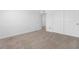 Bedroom showing neutral carpet with a closet and white sliding doors at 12367 Indigo Montage Rd # 3, Las Vegas, NV 89183