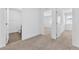 Hallway featuring neutral carpet, white doors and trim, and access to rooms at 12367 Indigo Montage Rd # 3, Las Vegas, NV 89183