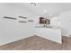 Open-concept kitchen featuring dark wood cabinets, granite counters, and stainless steel appliances at 12367 Indigo Montage Rd # 3, Las Vegas, NV 89183