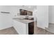 Kitchen featuring stainless steel appliances, dark wood cabinets, and granite countertops at 12367 Indigo Montage Rd # 3, Las Vegas, NV 89183