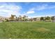 Expansive community green space with vibrant lawn, playground and open area for activities at 12367 Indigo Montage Rd # 3, Las Vegas, NV 89183