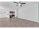 Spacious living room with modern flooring flowing into the kitchen area at 12367 Indigo Montage Rd # 3, Las Vegas, NV 89183