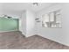 Open living area with modern plank flooring and ample sunlight at 12367 Indigo Montage Rd # 3, Las Vegas, NV 89183