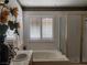Bright bathroom showcasing a standalone tub with tile flooring and a glass enclosed shower stall at 1255 Del Lilly Ln, Las Vegas, NV 89123
