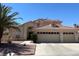 Charming two-story home showcasing a classic design, well-manicured lawn and a three car garage at 1255 Del Lilly Ln, Las Vegas, NV 89123