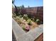 Landscaped flowerbed featuring a variety of plants and flowers at 1255 Del Lilly Ln, Las Vegas, NV 89123