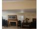 Comfortable living room features a cozy fireplace, classic decor, and shuttered windows at 1255 Del Lilly Ln, Las Vegas, NV 89123