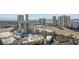 Panoramic aerial view showcases multiple hotels, parking structures, landscaping and a desert landscape in the distance at 200 W Sahara Ave # 3004, Las Vegas, NV 89102