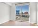Bright bedroom features a large window with views of the city at 200 W Sahara Ave # 3004, Las Vegas, NV 89102