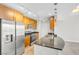 Modern kitchen with stainless steel appliances, granite countertops, wood cabinets, and stylish pendant lighting at 200 W Sahara Ave # 3004, Las Vegas, NV 89102