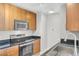 Bright kitchen featuring stainless steel appliances, wood cabinets and granite countertops at 200 W Sahara Ave # 3004, Las Vegas, NV 89102