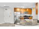 Well-lit kitchen with stainless steel appliances, wood cabinets and granite countertops at 200 W Sahara Ave # 3004, Las Vegas, NV 89102