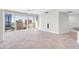 Bright living room with floor-to-ceiling windows offering panoramic city views and access to a private balcony at 200 W Sahara Ave # 3004, Las Vegas, NV 89102