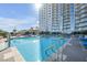 Rooftop pool on sunny day overlooking the city skyline and surrounding complex at 200 W Sahara Ave # 3004, Las Vegas, NV 89102