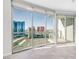 Large windows provide stunning city views in this room with natural light and access to an outdoor balcony at 200 W Sahara Ave # 3004, Las Vegas, NV 89102