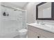 Clean bathroom featuring shower-tub combo, vanity and a framed mirror at 2101 Diamond Bar Dr, Las Vegas, NV 89117