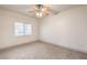 Bedroom with neutral carpet and a ceiling fan with light fixture at 2109 Echo Bay St # 104, Las Vegas, NV 89128