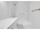 A modern bathroom with white marble tiling, sleek gold fixtures, and a convenient niche for toiletries at 2110 Los Feliz St # 1037, Las Vegas, NV 89156